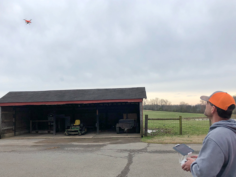 Farmer flying drone