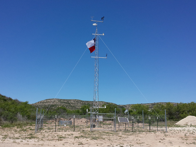 Weather monitoring site with large tower.