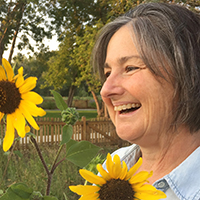 Dr. Stephanie Green with sunflower