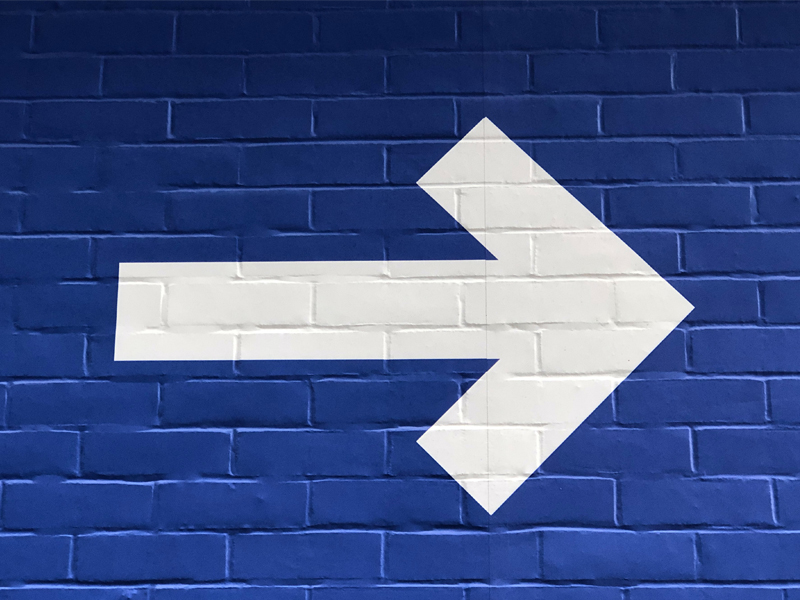 white arrow on a blue background