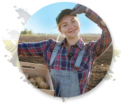 Woman farmer holding a box of potatoes